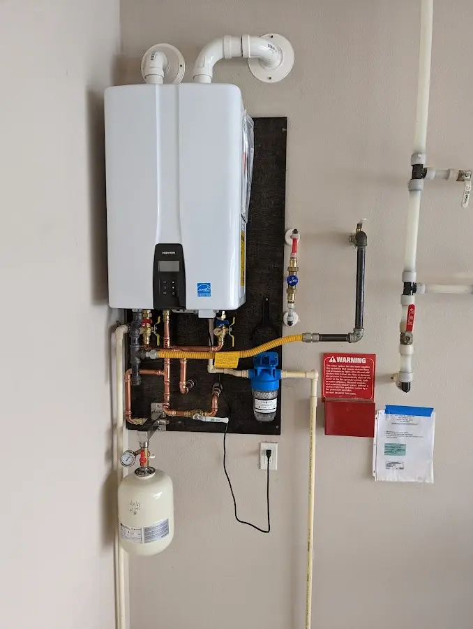 Professional plumber installing copper piping in a Wrightwood home